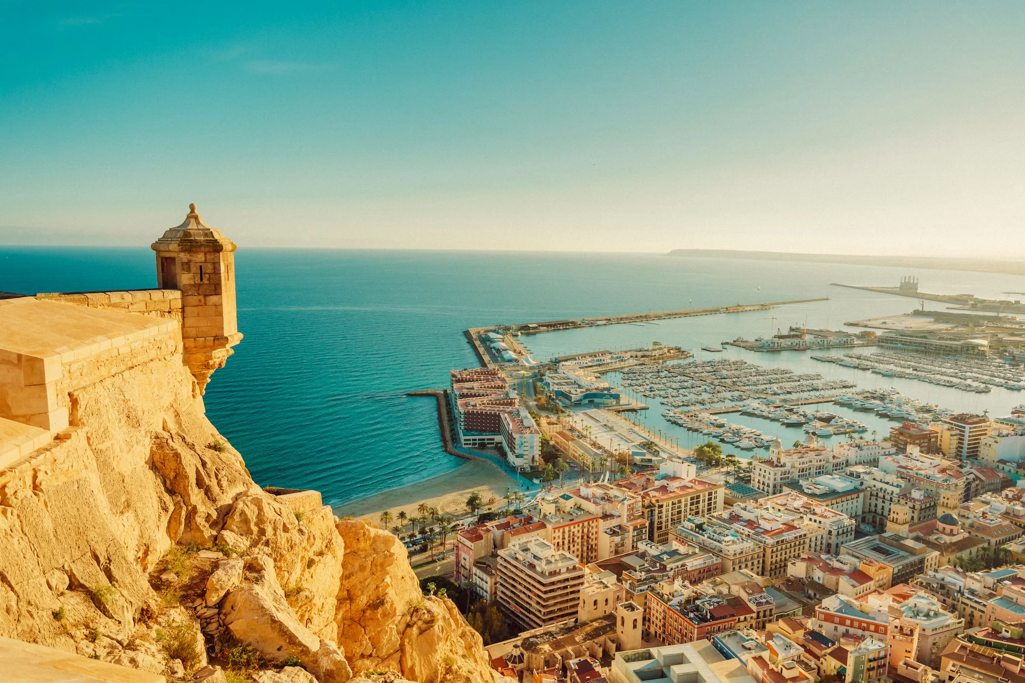 Mediterranean coastline near Alicante with warm sunset light over the sea